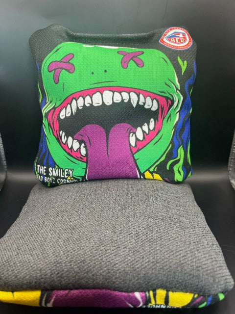 ACO stamped Smiley Cornhole Bag front